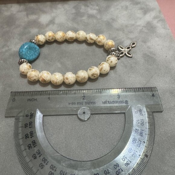 Turquoise Stone Cream and Gold Beaded Stretch Bracelet With Cross Charm - Picture 4 of 4